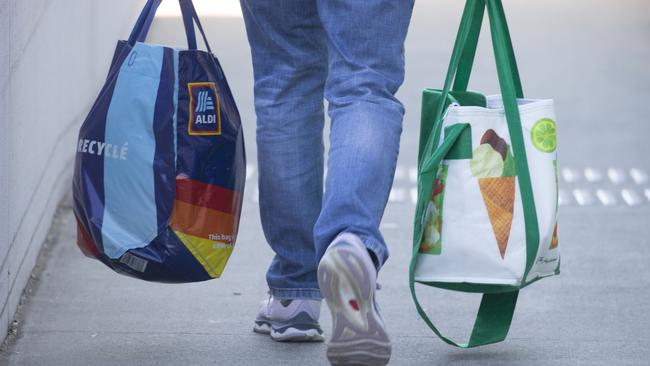 BRISBANE, AUSTRALIA - NewsWire Photos - JUNE 19, 2024: Generic photo of Australian shopping centre ALDI and Woolworths bags.Picture: NewsWire / Glenn Campbell