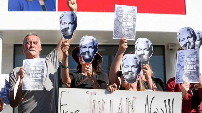 Free Julian Assange organiser Dean Jeffrey's (left) with his fellow protesters. Picture: Scott Powick