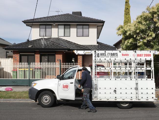 A glass repairman is working at the house. Picture: David Crosling