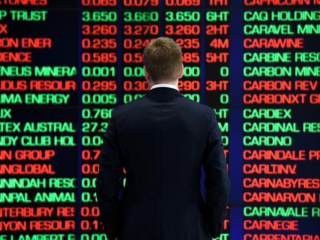 A man is seen looking at the digital market boards at the Australian Stock Exchange (ASX) in Sydney, Monday, March 9, 2020. The Australian share market has had its worst morning since the Global Financial Crisis in 2008, as the escalation of the coronavirus stifles international economic growth. (AAP Image/Bianca De Marchi) NO ARCHIVING