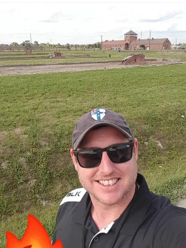 Tyler Baker-Pearce’s smiling selfie outside Auschwitz. Picture: Twitter