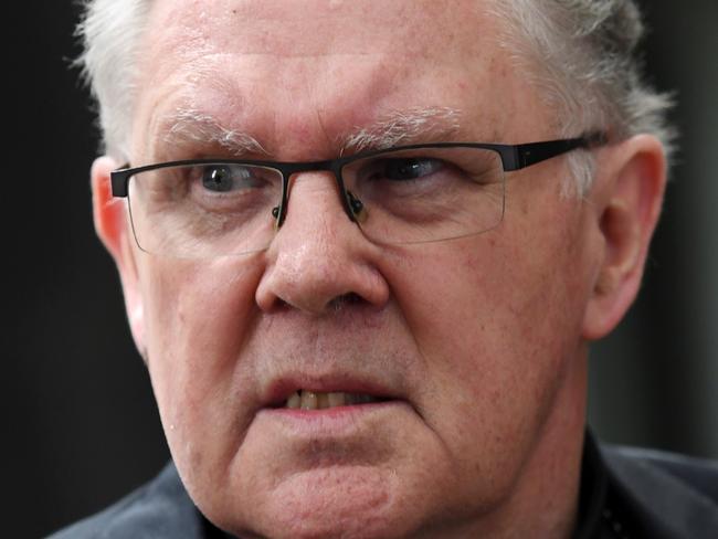 Brisbane Archbishop Mark Coleridge departs after giving evidence at the Royal Commission into Child Sexual Abuse in Sydney on Wednesday, Feb. 8, 2017. (AAP Image/Paul Miller) NO ARCHIVING