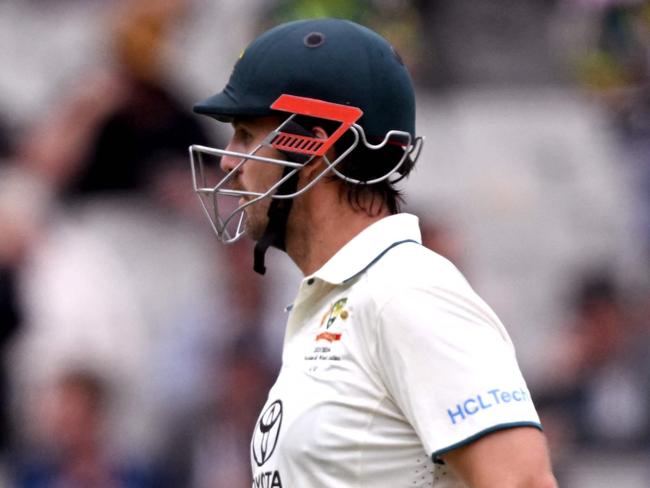 Mitch Marsh sporting a neck protector against Pakistan at the MCG. Photo by William WEST / AFP