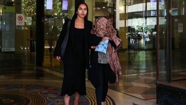 Monika Singh (face covered) appears at the Downing Centre District Court in Sydney over her role in an elaborate scheme with attempted to defraud NAB out of $21 million Sydney. Picture: NewsWire/ Gaye Gerard