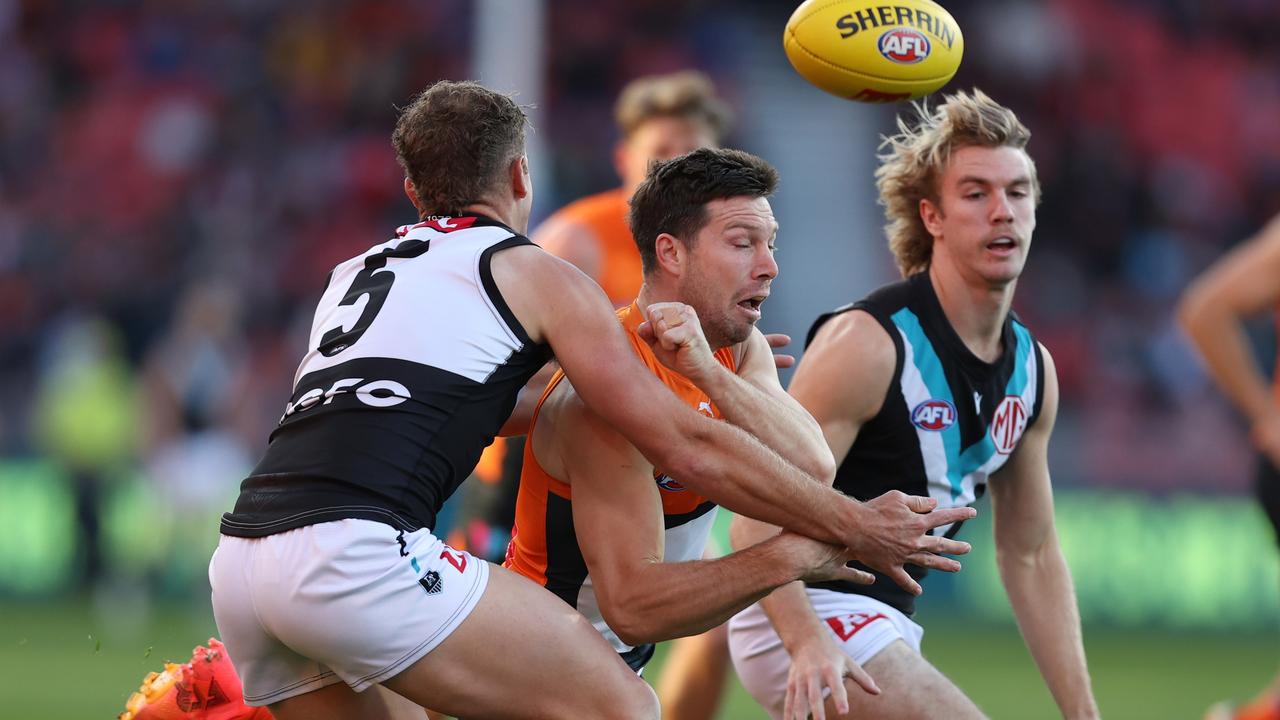 Toby Greene handballs under pressure. Picture: Jason McCawley/AFL Photos/via Getty Images