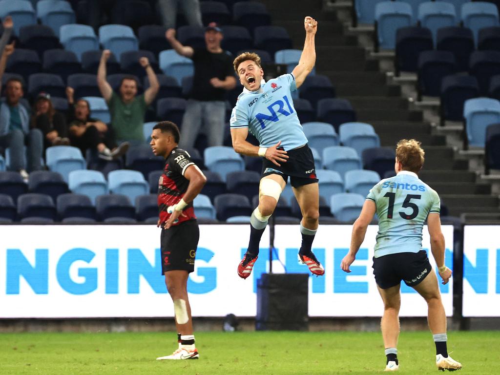 WaratahS’ Will Harrison celebrates after kicking a drop goal to beat the Crusaders in extra time. Picture: AFP