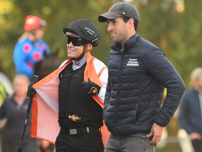 Jockey Craig Williams is seen with assistant trainer Ben Gleeson after riding Vow And Declare during a barrier trial at Cranbourne Racecourse in Cranbourne, Melbourne, Tuesday, February 4, 2020. (AAP Image/Vince Caligiuri) NO ARCHIVING