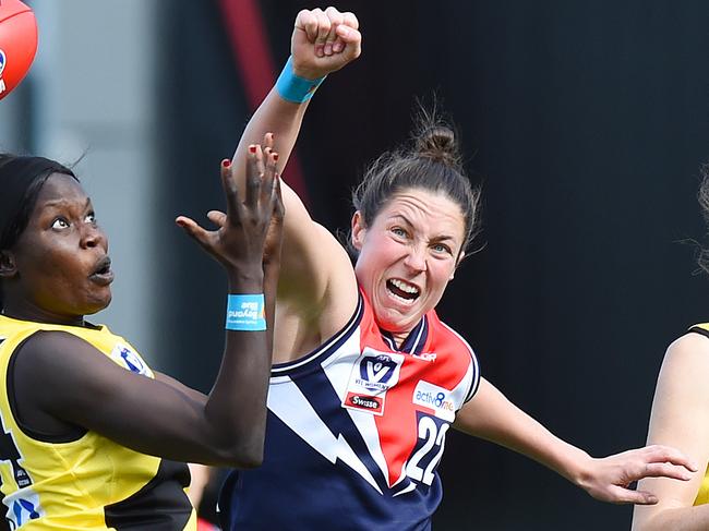 VFLW footy: Darebin Falcons v Richmond. (L-R) Richmond's Akec Makur Chuot (34) and Darebin's Georgia Hammond (22) Picture: Josie Hayden