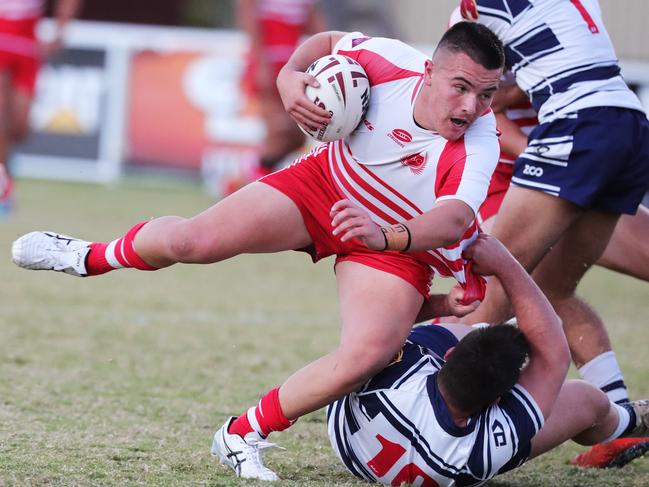 PBC’s Jack Cullen runs into some solid defence from St Mary’s Cooper Tate-Roche. Picture: Glenn Hampson