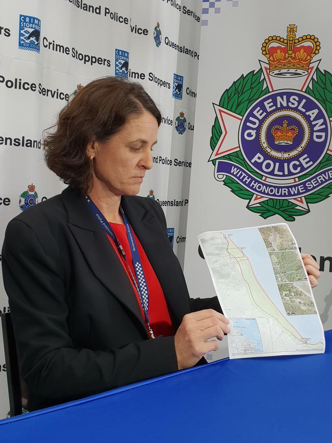 Detective Inspector of the Far North District Sonia Smith shows a map of the area police and SES are currently searching at Wangetti Beach. Picture: Andrea Falvo