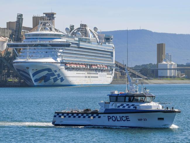 Water police patrol the contaminated cruise ship Ruby Princess while it berths in Port Kembla south of Sydney. Several SA cases were linked to the controversial cruise. Picture: Simon Bullard