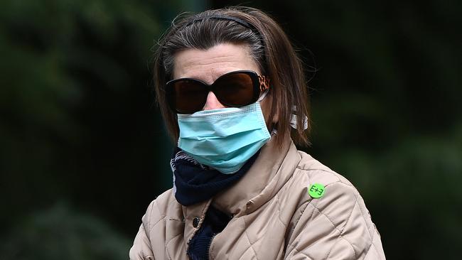 A woman wears a face mask in Melbourne on Monday. Picture: Getty Images