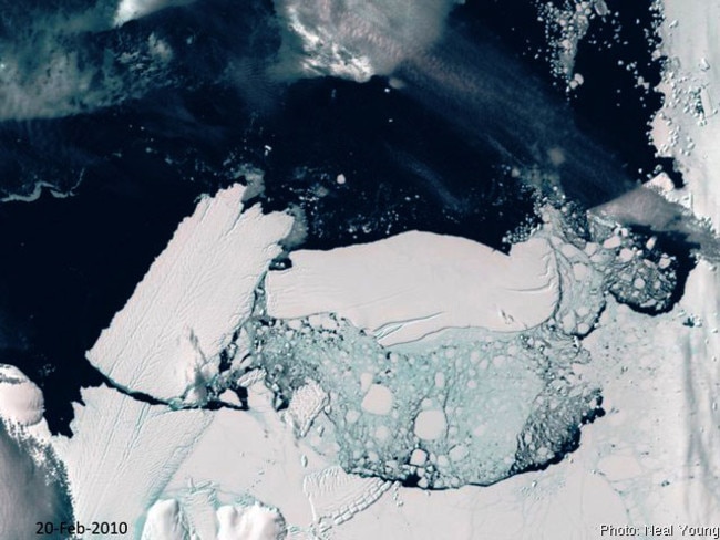 Clash of titans ... A satellite image showing the calving of the Mertz Glacier, left, after it was struck by a 97km-long iceberg in Antarctica. Such a chain of collapses could result in rapid sea level rise. Picture: Australian Antarctic Division.