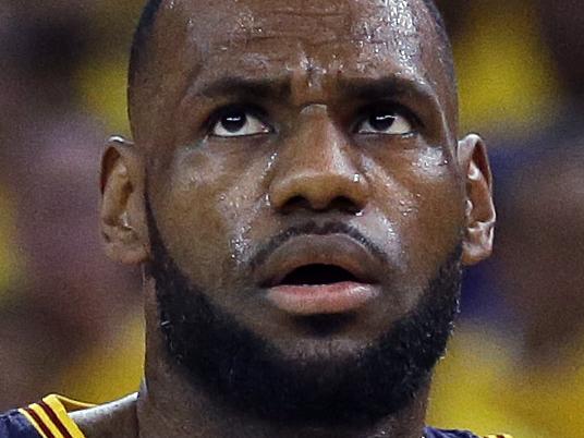 Cleveland Cavaliers forward LeBron James (23) stands on the court in front of head coach David Blatt during the first half of Game 2 of basketball's NBA Finals against the Golden State Warriors in Oakland, Calif., Sunday, June 7, 2015. (AP Photo/Ben Margot)