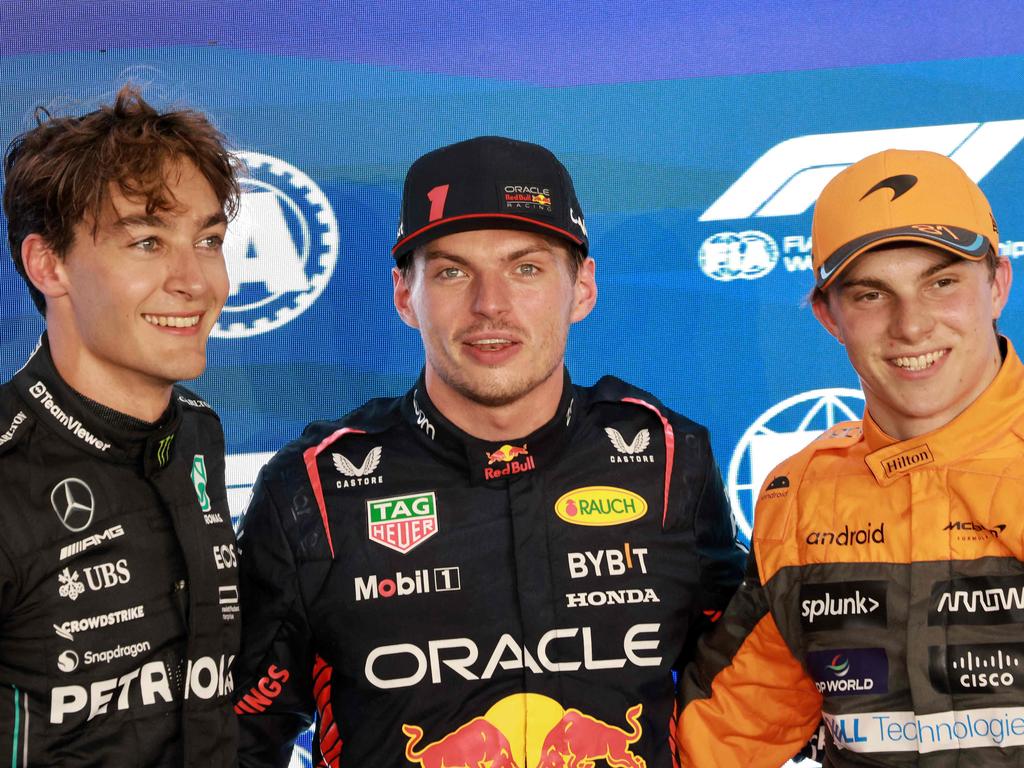 Verstappen is flanked by Russell (L), and McLaren's Australian driver Oscar Piastri (R) before the Qatari Formula One Grand Prix in 2023. Picture: Giuseppe CACACE / AFP