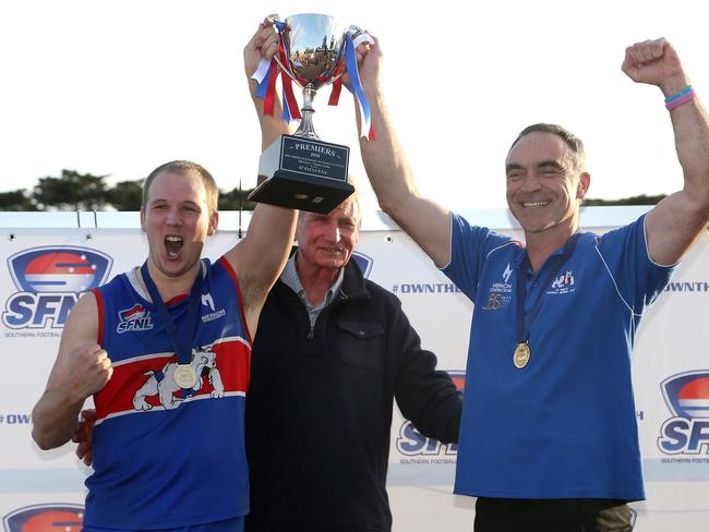 Kieran Knox (left) captain and Jason Heffernan coach of St Paul's celebrate with the trophy after Southern FNL Division 1 grand final: East Malvern v St Paul's on Saturday, September 22, 2018, in Springvale, Victoria, Australia. Picture: Hamish Blair