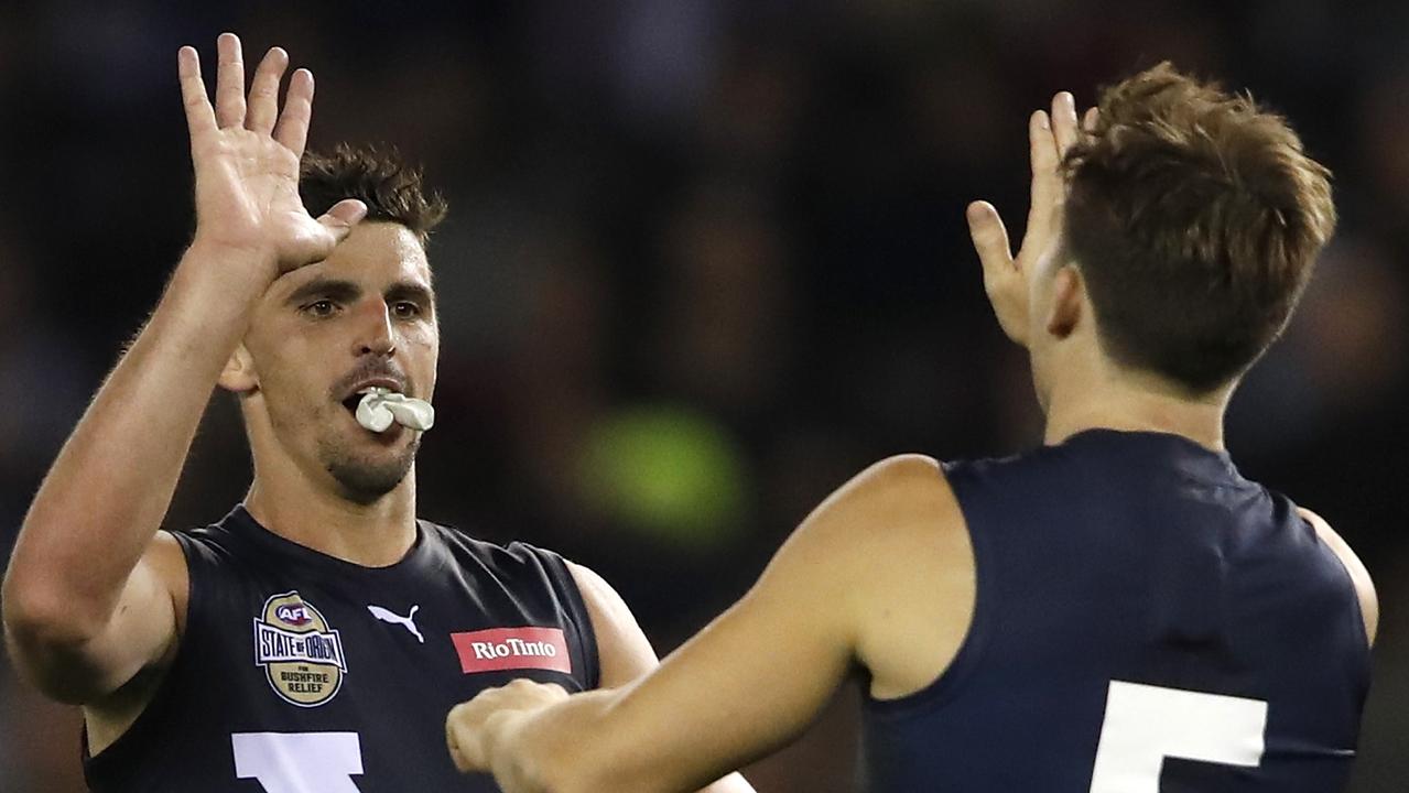 Victoria’s top SuperCoach scorer Toby Greene celebrates a goal with Scott Pendlebury.