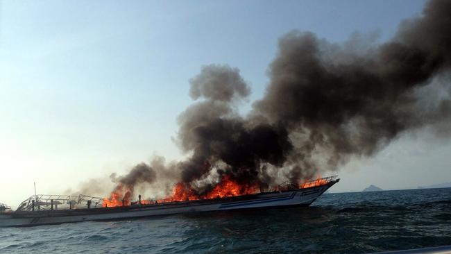 A general view shows the burning Phuket ferry near Noppharat Thara beach in Krabi province on April 8, 2015. Scores of foreign tourists endured a dramatic sea rescue after a blaze devoured a ferry travelling between two resort hotspots in southern Thailand, police said. AFP PHOTO