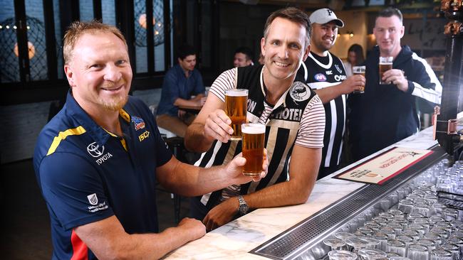 Ex-Crows player Wayne Weidemann and ex-Port player Darryl Wakelin toast being back at the front bar of The Moseley with former players Alipate Carlile and Peter Caven. Picture: Mark Brake