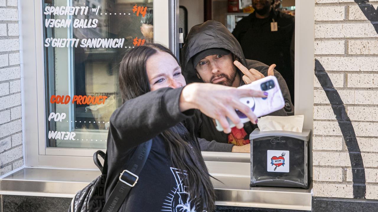 Eminem posed for photos with fans at the eatery. Picture: Scott Legato/Getty Images