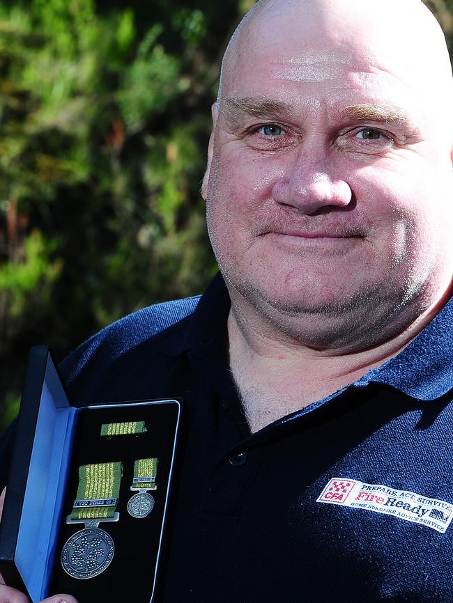 Upper Ferntree Gully CFA captain Peter Smith received the National Emergency medal for the Victorian Fires 2009. Picture by Derrick den Hollander