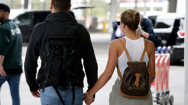 The couple held hands as they walked to a waiting car. Picture: Jonathan Ng