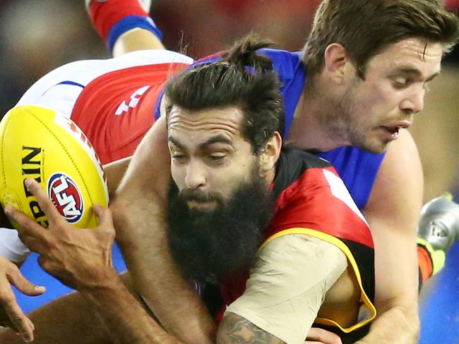 Courtenay Dempsey is tackled by Ryan Bastinac. Picture: Getty Images