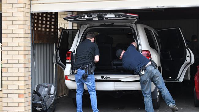 SA Police during Friday’s raids which resulted in the arrests of six people. Picture: David Mariuz/AAP