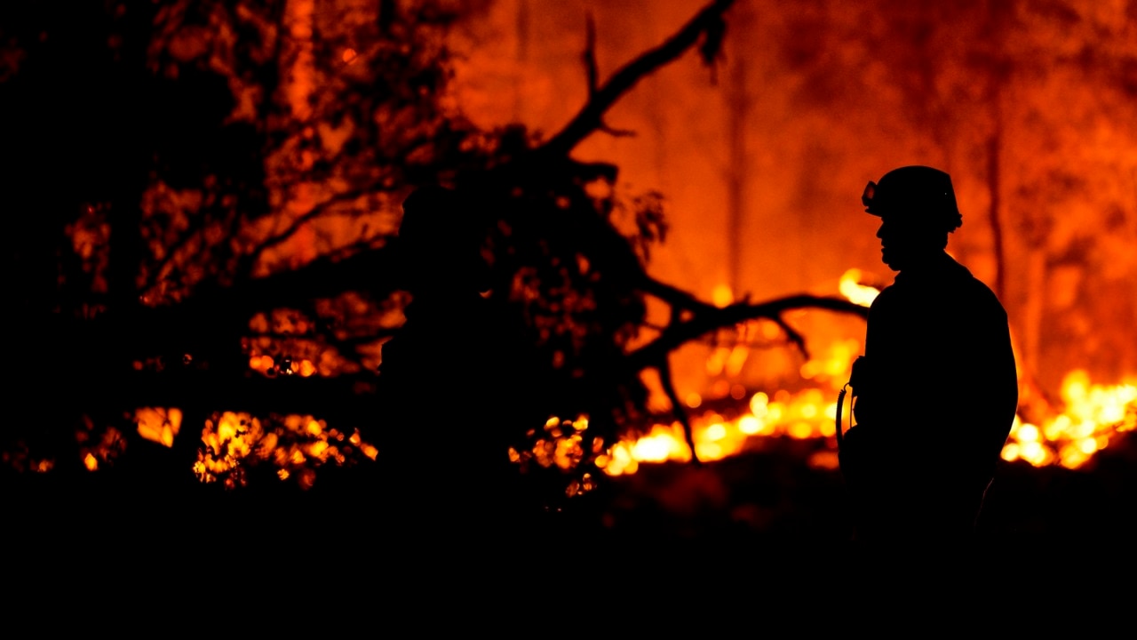 Second body found as crews battle bushfires in Queensland