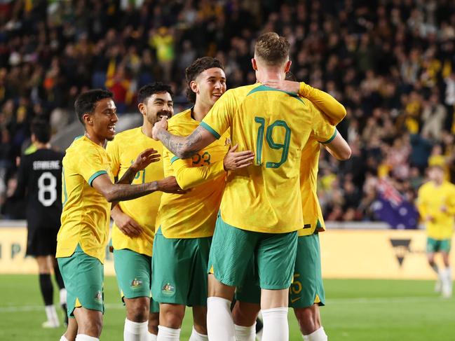 BRENTFORD, ENGLAND - OCTOBER 17: Harry Souttar of Australia celebrates with teammates after scoring the team's first goal during the Trans-Tasman Trophy international friendly match between Australia Subway Socceroos and New Zealand All Whites at Gtech Community Stadium on October 17, 2023 in Brentford, England. (Photo by Ryan Pierse/Getty Images)