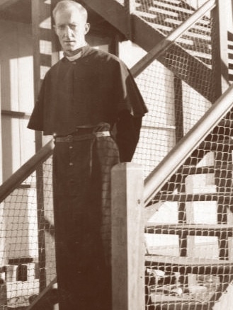 Percy Smith on the wooden steps of the original Church of the Ascension in Bath St, Alice Springs. Picture: St Francis House Project