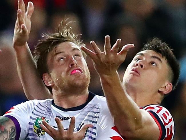 SYDNEY, AUSTRALIA - SEPTEMBER 30:  Cameron Munster of the Storm and Joseph Manu of the Roosters compete for the ball during the 2018 NRL Grand Final match between the Melbourne Storm and the Sydney Roosters at ANZ Stadium on September 30, 2018 in Sydney, Australia.  (Photo by Cameron Spencer/Getty Images)