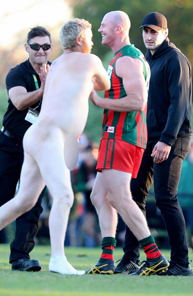 A streaker confronts Barry Hall during the match. Picture: Alex Coppel