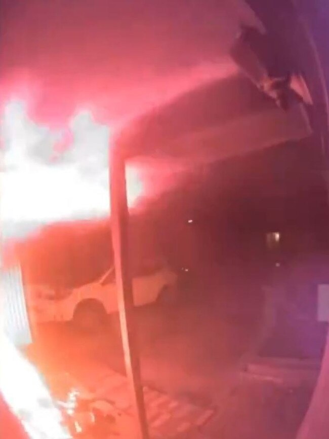 CCTV from the front porch of the house captures the moment a bin of ashes bursts into flames, leaving a trail of destruction in a matter of seconds. Picture: 7NEWS