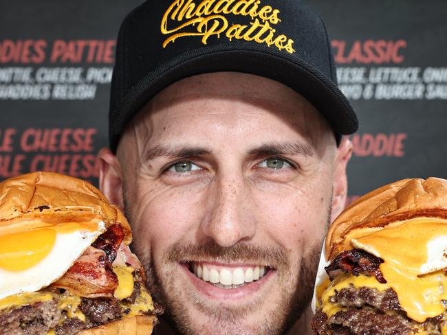 Owner Taran Lee, from Runaway Bay restaurant Chaddies Patties, with some of the Burgers that won the best burger on the Gold Coast. Picture Glenn hampson