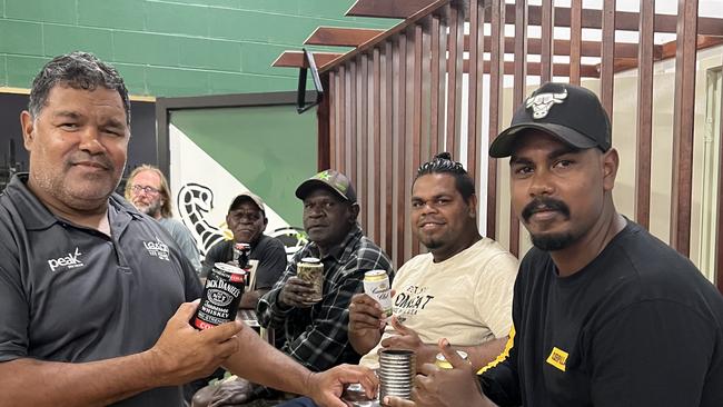 Mayor Wayne Butcher enjoys a drink with Lockhart River locals at the social club. Picture: supplied.