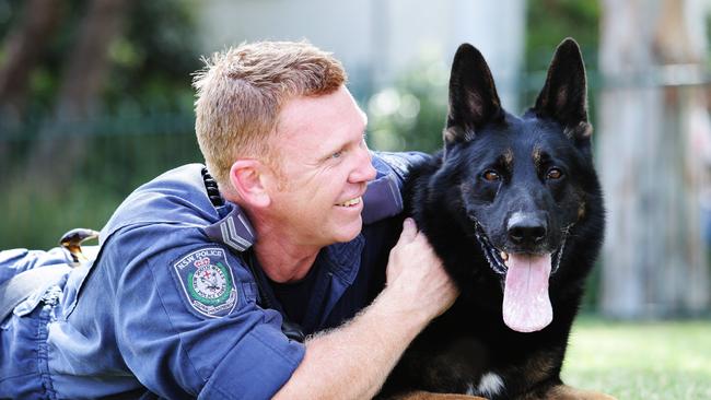 Senior Constable Luke Warburton with Hero police dog Chuck who recently died.