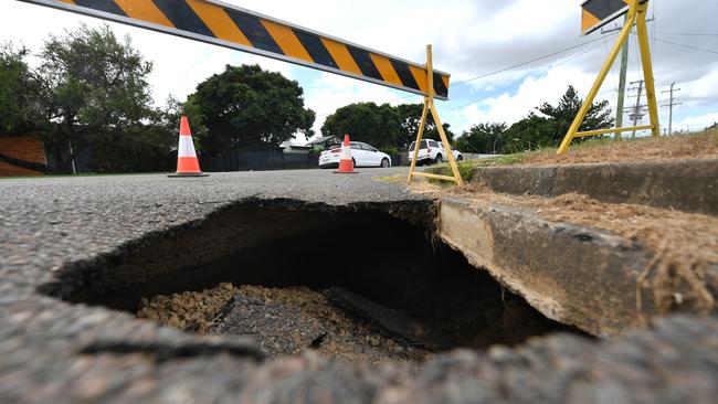 Several sink holes have developed in a clump of streets in Aitkenvale. This sink hole is located on the corner of Warili and Wareham Streets. Picture: Evan Morgan