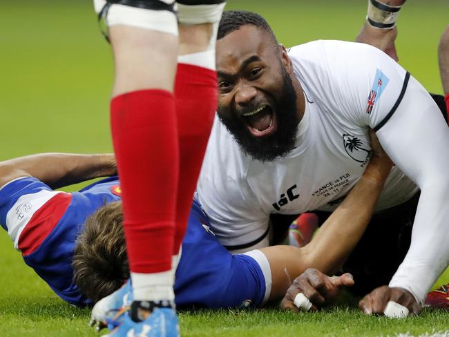 FILE - In this Nov. 24, 2018, file photo, Fiji's Semi Radradra celebrates after scoring a try against France during a rugby international between France and Fiji at Stade de France in Paris. Teams from the Pacific islands are immensely popular around the world and their appearances at the Rugby World Cup are likely to attract large and admiring crowds. But an appreciative welcome won't disguise the fact that the Pacific nations begin the tournament under a considerable handicap. (AP Photo/Christophe Ena, File)