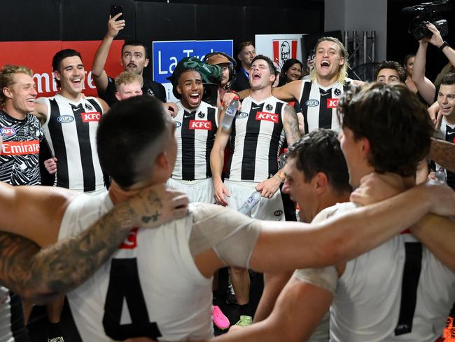 BRISBANE, AUSTRALIA - MARCH 28: Players of the Magpies sign the team song after the round 3 AFL match between the Brisbane Lions and Collingwood Magpies at The Gabba, on March 28, 2024, in Brisbane, Australia. (Photo by Matt Roberts/AFL Photos/Getty Images)