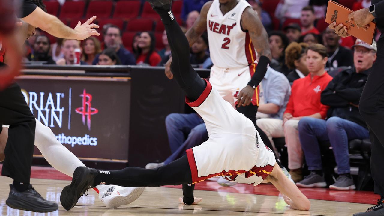 Herro got tossed to the floor. (Photo by Alex Slitz/Getty Images)