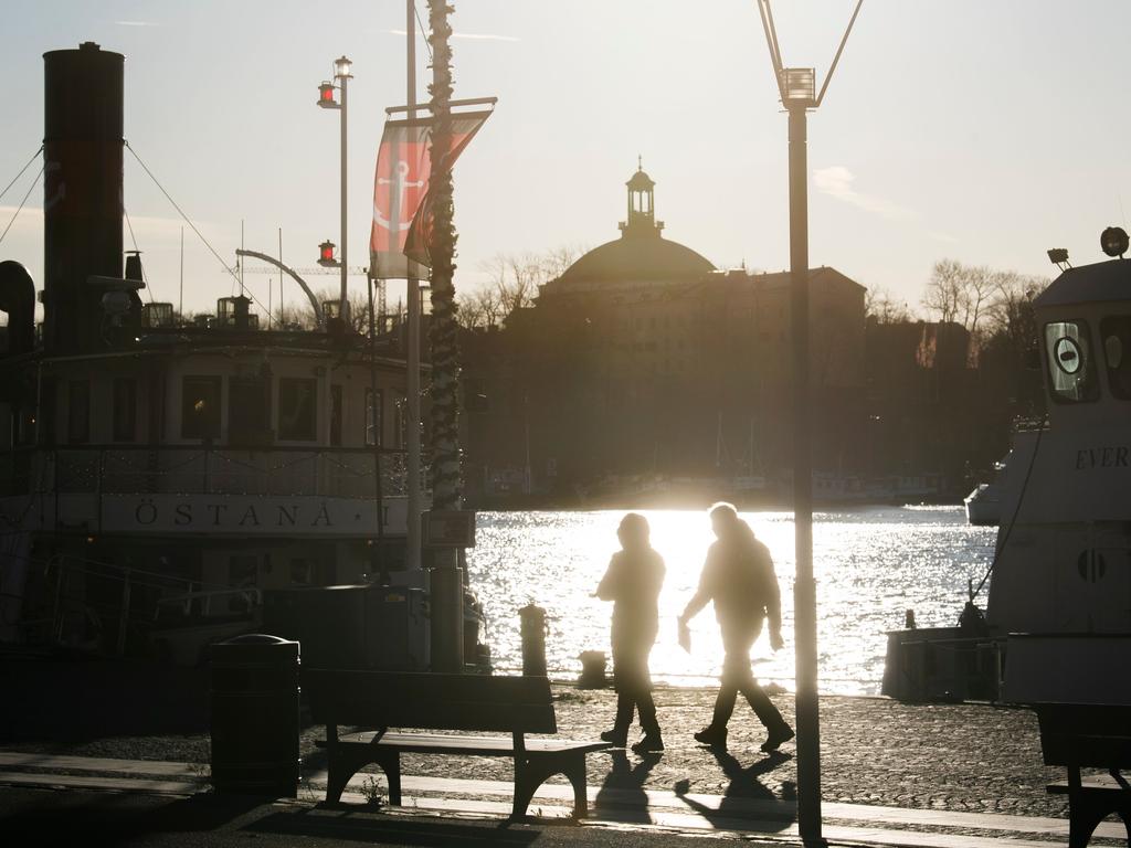 People on the quay side in Stockholm in November. Picture: Fredrik SANDBERG / TT News Agency / AFP) / Sweden.