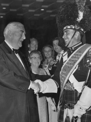 Sir Robert Menzies shakes hands with Mr Semple in 1966.