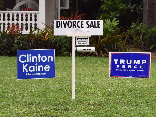 Looks like this couple couldn’t put their differences aside. Political signs are seen with a divorce sign in front of a house in Coral Gables, Florida on November 8, 2016. Picture: AFP PHOTO / RHONA WISE
