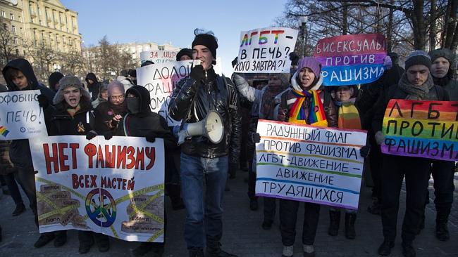 Russian gay rights activists march along a Moscow boulevard on January 19. Slogans read: 'Down with all Kinds of Fascism', 'Homophobia in to the Fire!', 'For Peace without Racism!', and 'Bisexuals Against Fascism'.