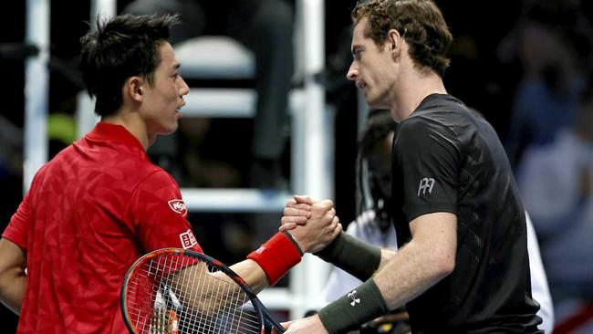 Britain's Andy Murray (right) shakes hands with Kei Nishikori of Japan after winning their ATP World Tour Finals singles tennis match. Picture: Alastair Grant