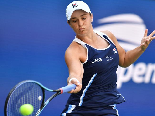 Australia's Ashleigh Barty hits a return to Denmark's Clara Tauson during their 2021 US Open Tennis tournament women's singles second round match at the USTA Billie Jean King National Tennis Center in New York, on September 2, 2021. (Photo by ANGELA WEISS / AFP)