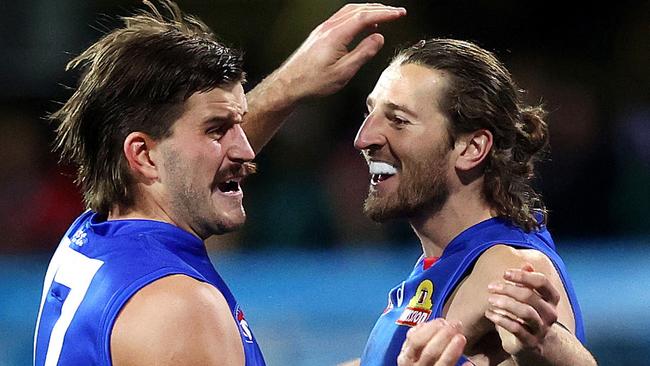 Marcus Bontempelli celebrates a goal with Josh Bruce after the Bulldogs captain broke free of the clamps against the Swans. Picture: Phil Hillyard