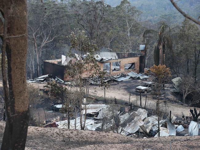 9/11/2019:  the day after a fierce bush fire claimed the lives of 2 people in the area, burnt out  peoples homes and houses smoulder at Wytaliba  located deep in a remote valley east of Glen Innes, NSW. Lyndon Mechielsen/The Australian