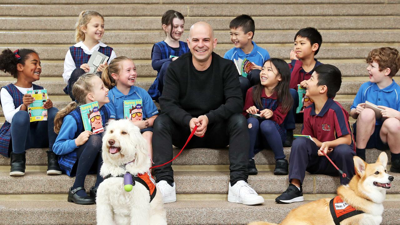 Children's book author, Matt Stanton with school kids Sarah Ochwada, Jordan Lubbers, Madeleine Pennington, Olivia Philps, Madeleine Nicholas, Rockwell Santos, Anna Nakano, San Lee, Justin Diet-Wine, and Spencer Nash, and dogs Sandy and Tyme, at the Opera House for Australian Reading Hour. Picture: Tim Hunter
